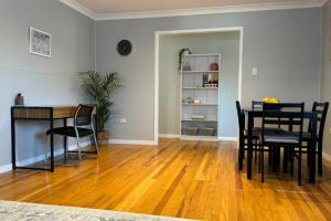 a living room with a dining room table and chairs at Healy Retreat in Mary Kathleen