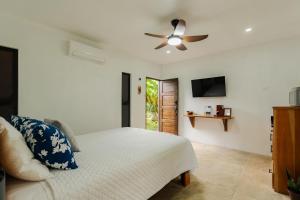 a bedroom with a bed and a ceiling fan at Creekside Lofts #1 in Fortuna