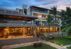 an exterior view of a building with a restaurant at The Rockwall Boutique Hotel Bentota in Bentota
