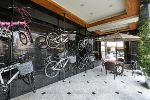a group of bikes hanging on a wall at Golden Pacific Hotel in Taichung