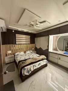 a bedroom with a large bed and a window at sun vacation resort in Visakhapatnam