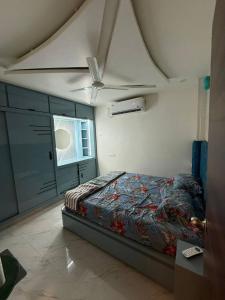 a bedroom with a bed and a ceiling at sun vacation resort in Visakhapatnam
