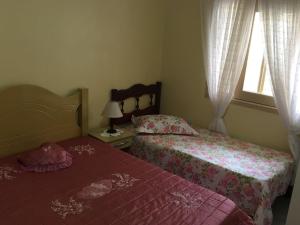 Una cama o camas en una habitación de Apto 102 Maria Helena