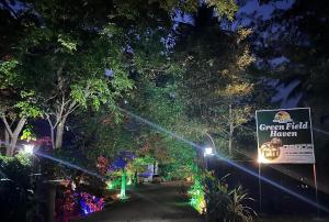 a street at night with lights and a sign at Greenfield Haven in Polonnaruwa