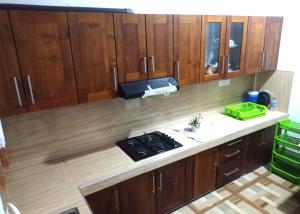 an overhead view of a kitchen with wooden cabinets at Ehana holiday in Tangalle