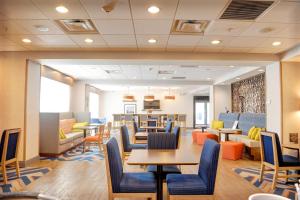 a waiting room with tables and chairs in a hospital at Hampton Inn Crystal River in Crystal River