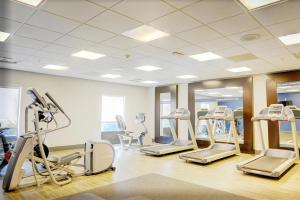 a gym with several tread machines and mirrors at Hampton Inn Crystal River in Crystal River