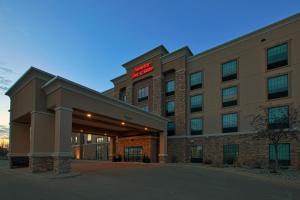 a hotel with a sign on the front of it at Hampton Inn and Suites St. Cloud in Saint Cloud