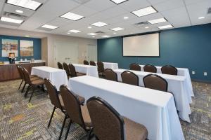 a conference room with tables and chairs and a podium at Hampton Inn and Suites St. Cloud in Saint Cloud +31 photos