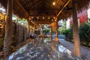 an outdoor dining area of a resort with a table at Banyan Villa Nha Trang in Nha Trang