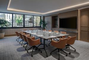 a conference room with a long table and chairs at Doubletree By Hilton Istanbul Macka in Istanbul