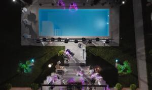 an overhead view of a stage with a large screen at The Crown Pool Villa in Belgrade +61 photos