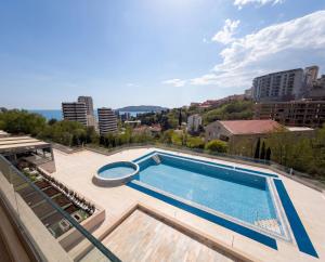 a swimming pool on the roof of a building at Status S in Bečići