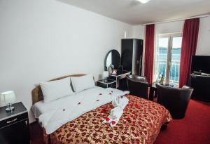 Postel nebo postele na pokoji v ubytování Hotel Azzurro