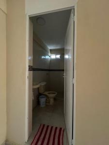 an open door to a bathroom with a toilet at Apartamento Turiksa in Acapulco
