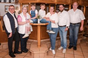 a group of people posing for a picture at Gasthaus Stroh in Buchholz