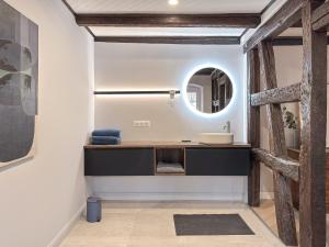 a bathroom with a sink and a mirror at Maison Alsacienne 4Ch & Suite Parentale sur la Route des Vins in Marlenheim +15 photos