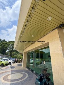 a motorcycle parked in front of a car dealership at Tokiyo Suites Hotel Kinta River Ipoh Town in Ipoh