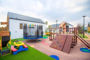 a playground with a slide and play equipment at Terra Sky Home in Pak Chong
