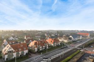 a city with houses and a street with cars at Sandy View - spacious studio flat near the beach in Nieuwpoort