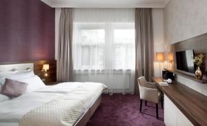 Postel nebo postele na pokoji v ubytování Mamaison Residence Sulekova Bratislava