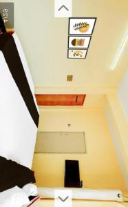 a view of a room with a bed and a ceiling at M Balaji inn in Vellore