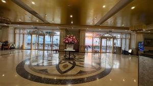 a lobby with a vase of flowers on a table at Luxury Studio Infinity Pool Golden Bay in Danang +61 photos