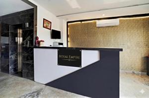 a lobby with a reception counter with a hotel arrive sign at GREAT ROYAL eMPIRE in Tājganj
