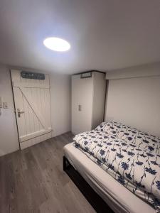 a bedroom with a bed and a garage door at ZK Zimmer in Stuttgart