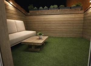 a living room with a couch and a table at Maison cosy proche plage in Elne