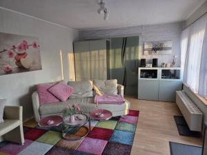 a living room with a couch and a table at Ferienhaus Kabitschke in Dobbrikow