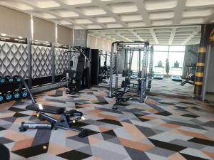 a gym with several treadmills and weights at Yana Apec Phu Yen in Tuy Hoa
