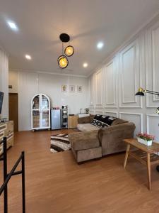 a living room with a couch and a table at Clamitan House Padalarang in Padalarang
