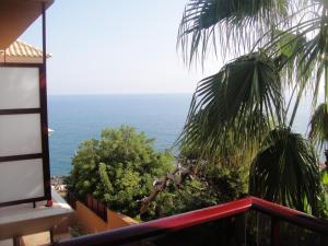a view of the ocean from a balcony at Aparthotel El Faro in Cullera