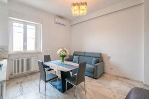 a living room with a table and a couch at White Loft by Symphonya Luxury Holiday Rentals in Gallipoli