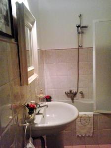 a bathroom with a white sink and a shower at A Casa di Amelie in Palermo +77 photos