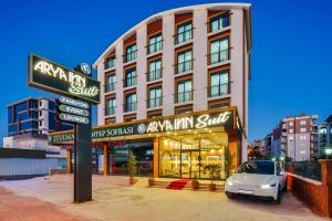 a car parked in front of a building at Arya inn suit in Serik
