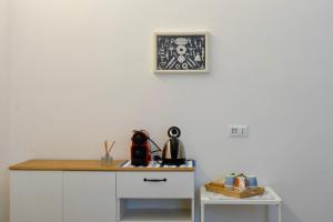 a kitchen with a counter with a tea kettle on it at CadiSmart in La Spezia