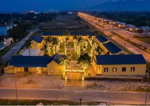 an aerial view of a building at night at Serena Xuân Thành Hotel in Hà Tĩnh +8 photos