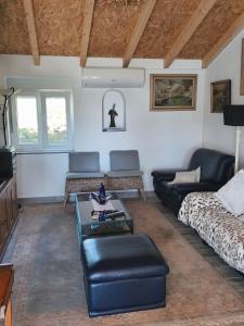 a living room with a couch and a table at Casa da Roda in Arronches