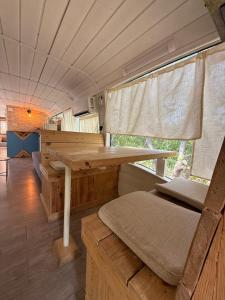 a dining room with a table in a trailer at צימרים בצפון - קאמפ דיוויד in Sheʼar Yashuv +37 photos