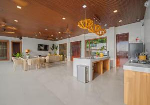 a large room with a kitchen and a living room at Villa Seresa Premium- La Union in Bacnotan