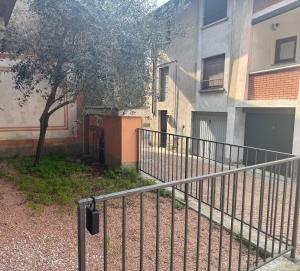 a metal fence in front of a building at Casa ajolote in Cunardo