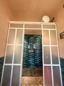 a sliding glass door in a room with a wall at The Amar Vilas in Dehradun +14 photos