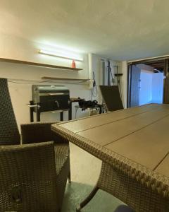 a room with a table and chairs and a printer at Domek Eve in Giżycko
