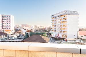 a view of a city from the roof of a building at Modern Apartment with Balcony & Fast Wi-Fi & Self Check-in in Shkodër