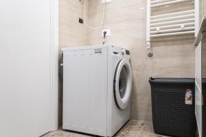 a white washer and dryer in a bathroom at Modern Apartment with Balcony & Fast Wi-Fi & Self Check-in in Shkodër +40 photos