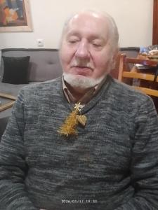 an older man with a tie on his neck at Hotel in Tbilisi City