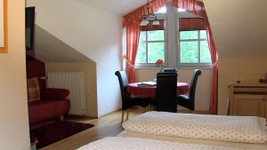 Posezení v ubytování Landgasthof zum Hirschenstein, Pension Garni