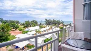 a balcony with chairs and a view of the ocean at Mosaic condominium RoomBD64M in Klaeng